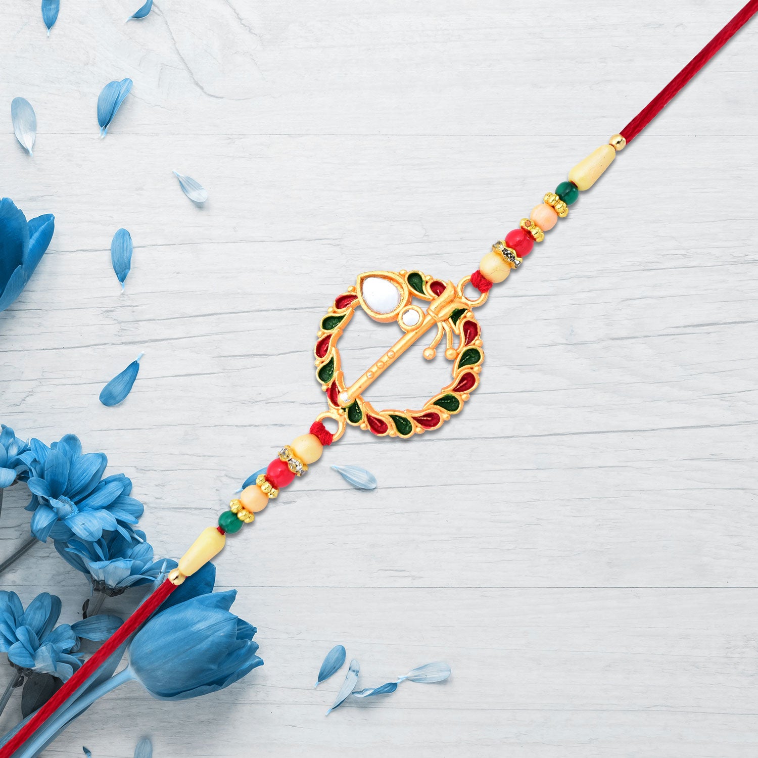 Krishna Flute Rakhi With Colorful Leaf Motif  Beads Krishna Flute Rakhi With Colorful Leaf Motif  Beads
